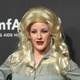 Musician Ellie Goulding at Dolly Parton at the 2017 amfAR & The Naked Heart Foundation Fabulous Fund Fair. Image via Getty.